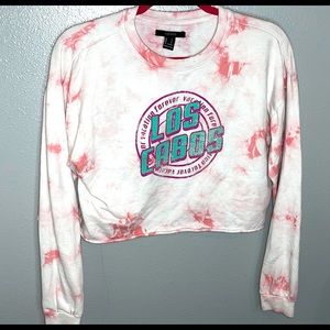 Pink and white cloudy look cropped shirt that says Los Cabos